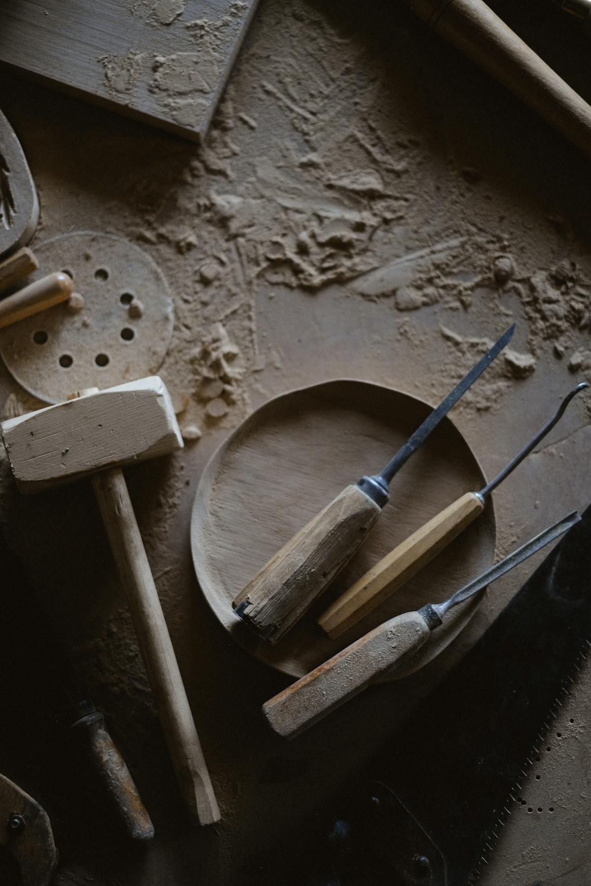 Traditional woodworking workbench with hand tools